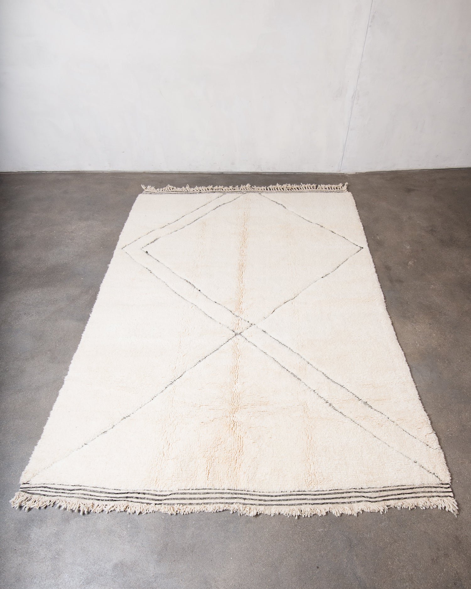 Modern, designer, handcrafted Berber rug from Morocco. Beniourain carpet with minimalist design, natural wool pile and a fluffy texture.